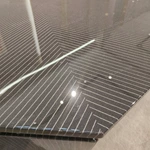 Contemporary Geometric Coffee Table with Carbon Fiber-Effect Top and Contrasting Accent